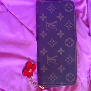 Authentic Louis Vuitton Clemence w Flower charm